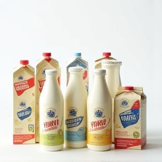 Cartons and bottles of Warrnambool Dairy Foods Wholesome Milk